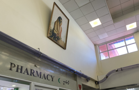 Photo of Pharmacy and Gandhi Portrait by Anu Ahmed