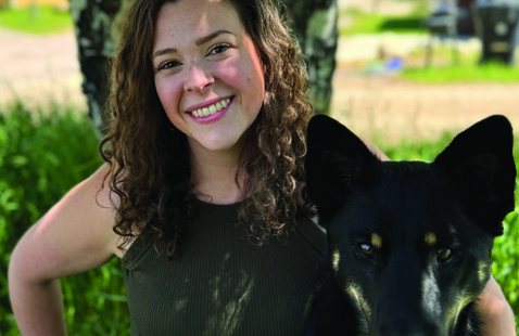 Kelsey Bowen poses for a photo with her dog