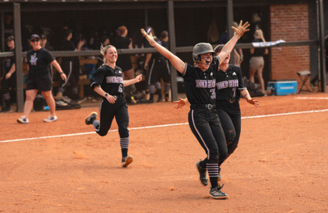 Softball girls running onto field