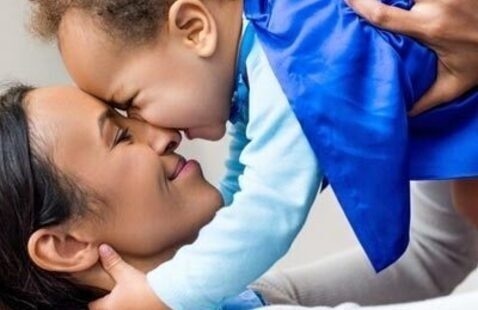 mother plays with baby