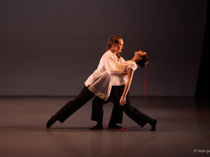 Two dancers on stage, Student Dance Concert.