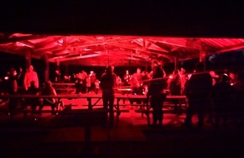 people in shelter under red light