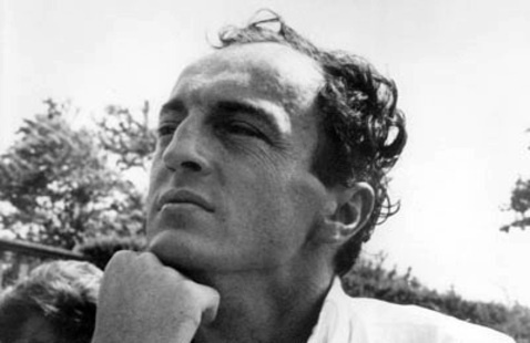 black and white image of Frank O'Hara, he poses resting his chin on his hand