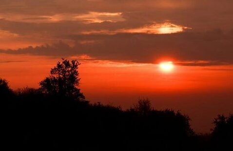 A sunset in the distance over mountains