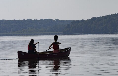 2 people canoeing on lake