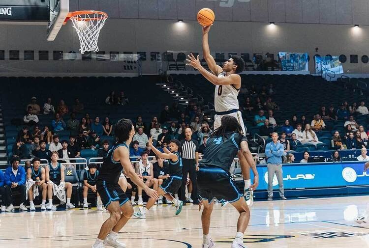 Triton basketball player shooting a floater