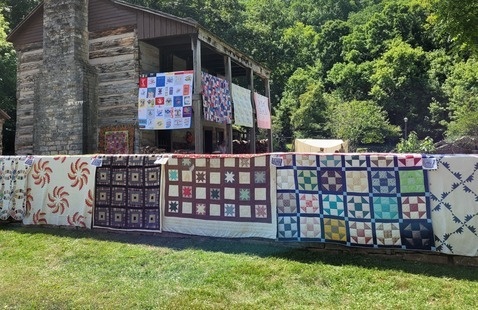 The upper residence and original wall in the village decorated with quilts.