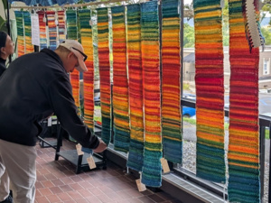 Colgate faculty and staff view sample Tempestries, during the project founders’ September visit to campus
