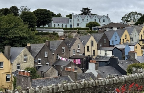a row of colorful yellow, blue, and brown houses