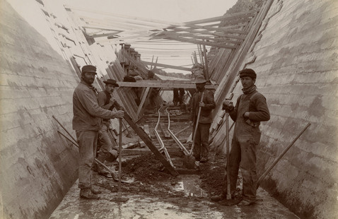 workmen in lined tunnel with temporary rails, 1905. Photographer Walter J. Lubkin. William E. Swift, Sr. Truckee Canal Construction Col-lection, NC1446. 