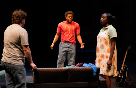 three people on stage