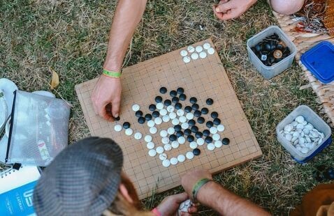 People enjoying a game of Go