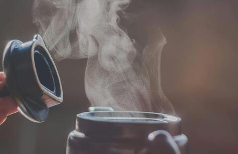Steam coming from a warm beverage in a cup