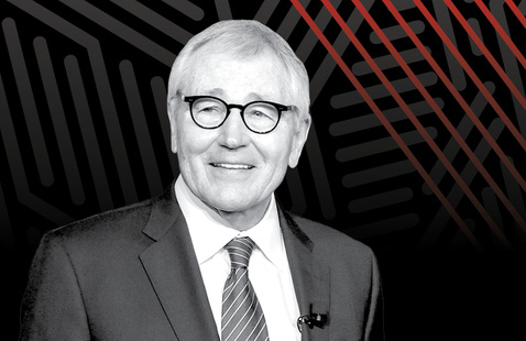 A black and white photo of Chuck Hagel with a black and red patterned background.