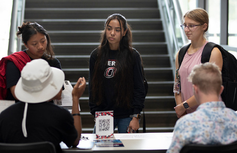 Students in front of staircase