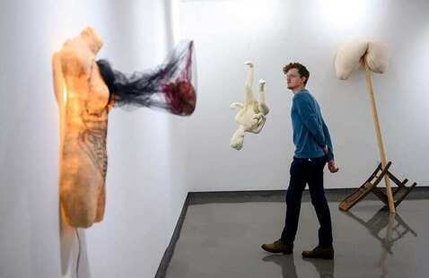 Person looking at art exhibits