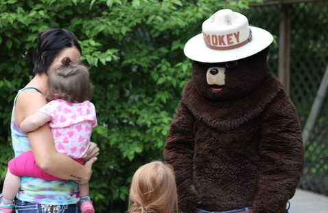 Smokey greeting guests
