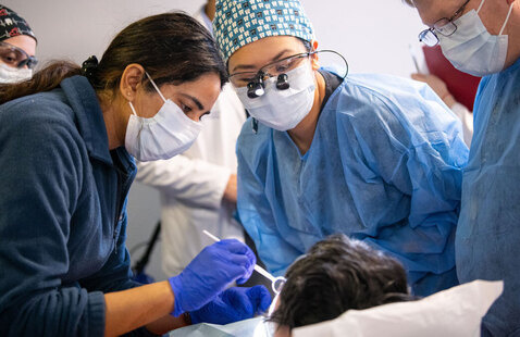 Dental Hygiene Students working on patient