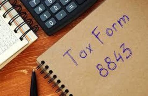 Notebook with words Tax form 8843