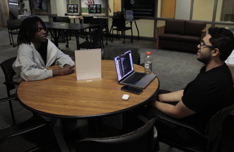 Two people sitting at a table