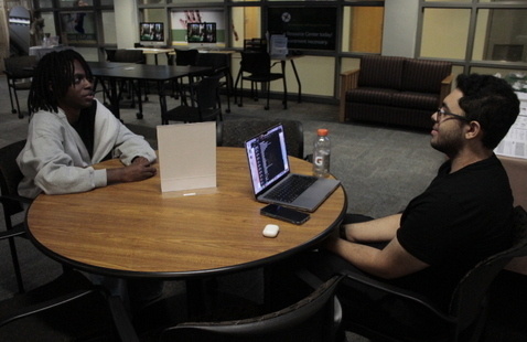 Two people sitting at a table