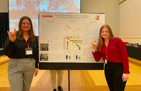 Students present their research on sustainable composting.