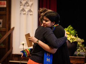 Student and mentor hug during Stoling Ceremony, 2023.