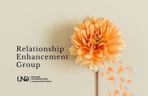 Bloomed orange flower with text: relationship enhancement group