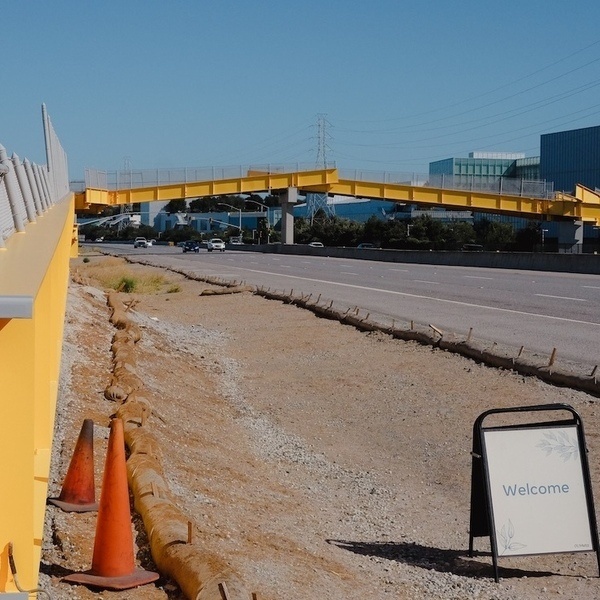 an image of a welcome sign by a construction site