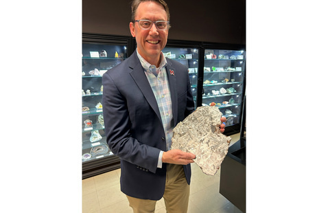 A person presenting a an object at the collection