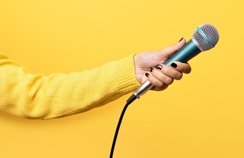 A person holding a microphone