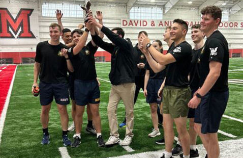Students on the Navy team celebrate winning the 2025 Battle of the Branches.