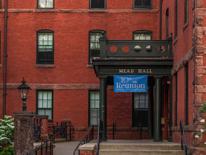 Mead Hall with a "tenth reunion" banner hanging above the entrance.