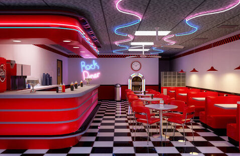 A 1950's style diner, compete with black and white tiling, a jukebox, neon lights, and red booths.