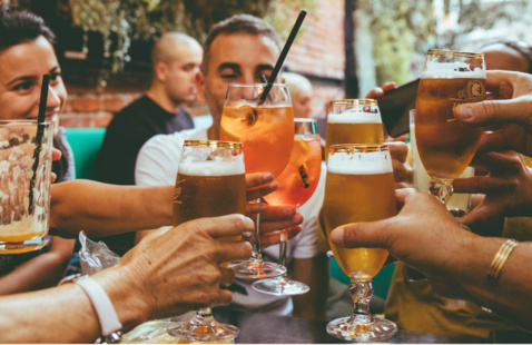 People at a bar with drinks