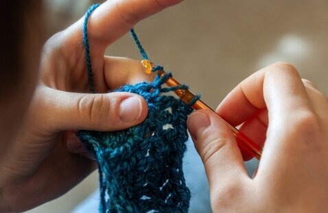 Hands of a person crocheting