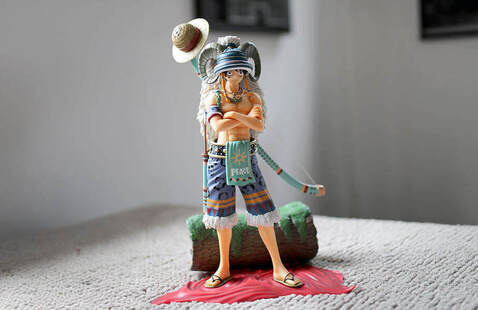 image of an anime figure posing with a sword