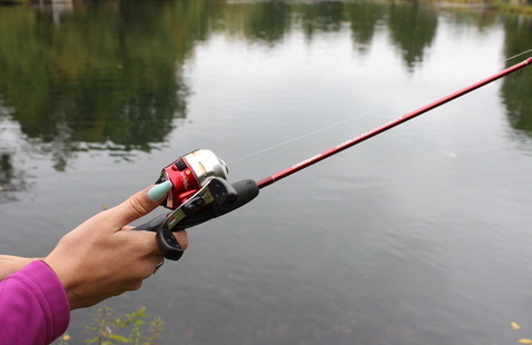 fishing rod being held