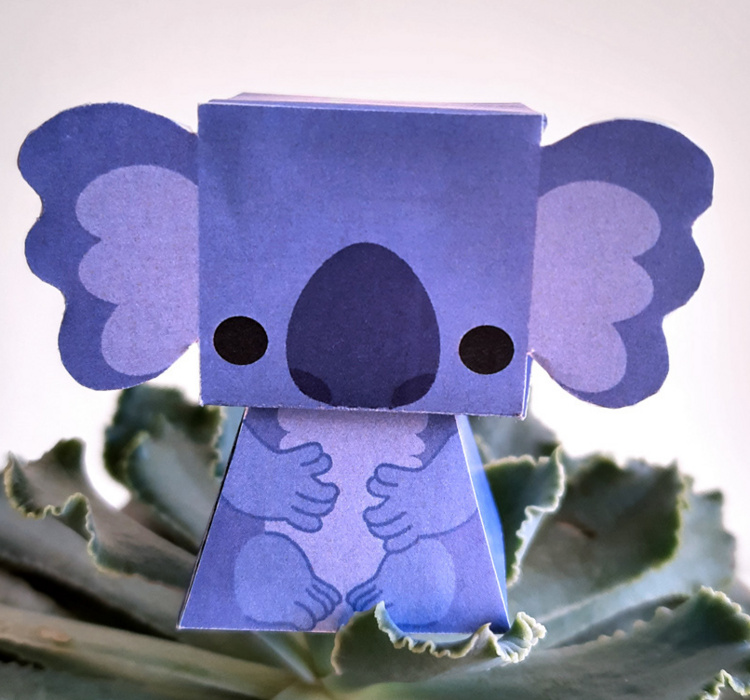 photo of a paper toy that is shaped like a koala
