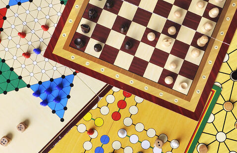 A collection of board games spread on a table