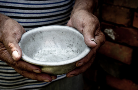 Hands holding an empty bowl.