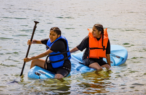 Students on a kayak in Lake Tahoe