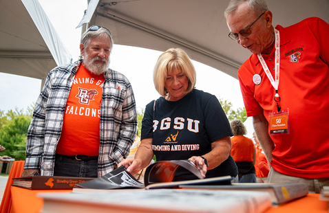 Alumni looking at historical BGSU photos