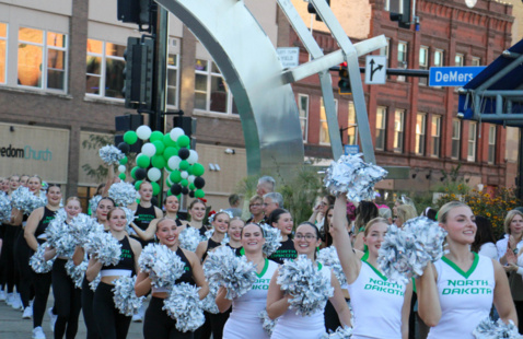 Cheerleaders cheer at the pep rally in Town Square