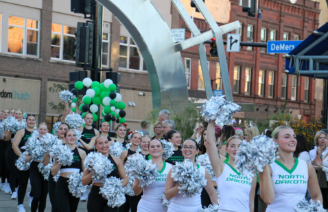 Cheerleaders cheer at the pep rally in Town Square