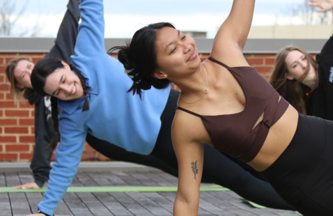 group doing pilates outside