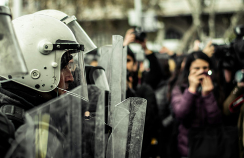 police with shields at a protest