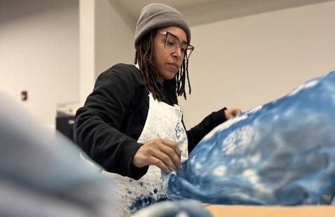 Professor Jillian Browning creating art in their studio.