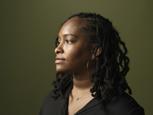 Zakiya Collier appears with her profile and wearing a black shirt