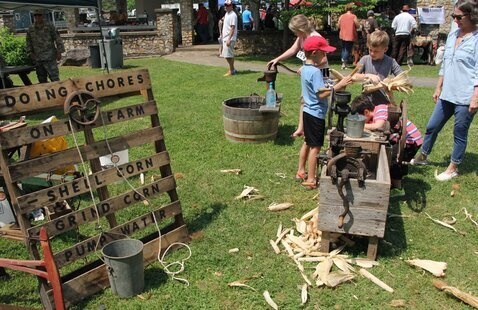 Corn shelling at Pioneer Day 
